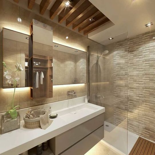 Salle de bain moderne avec lavabo, miroir, éclairage doux et murs en pierre.